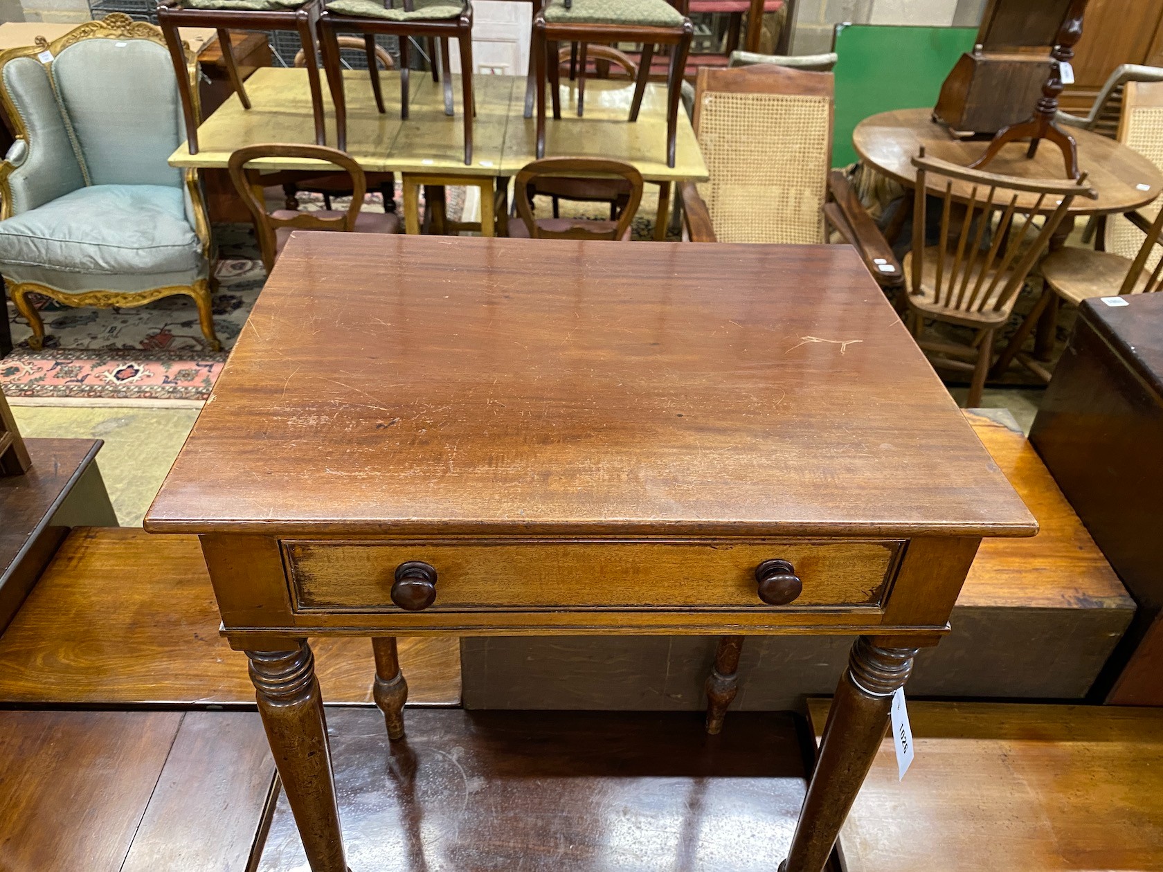 An early Victorian mahogany side table fitted drawer on turned legs width 56cm, depth 42cm, height 75cm.